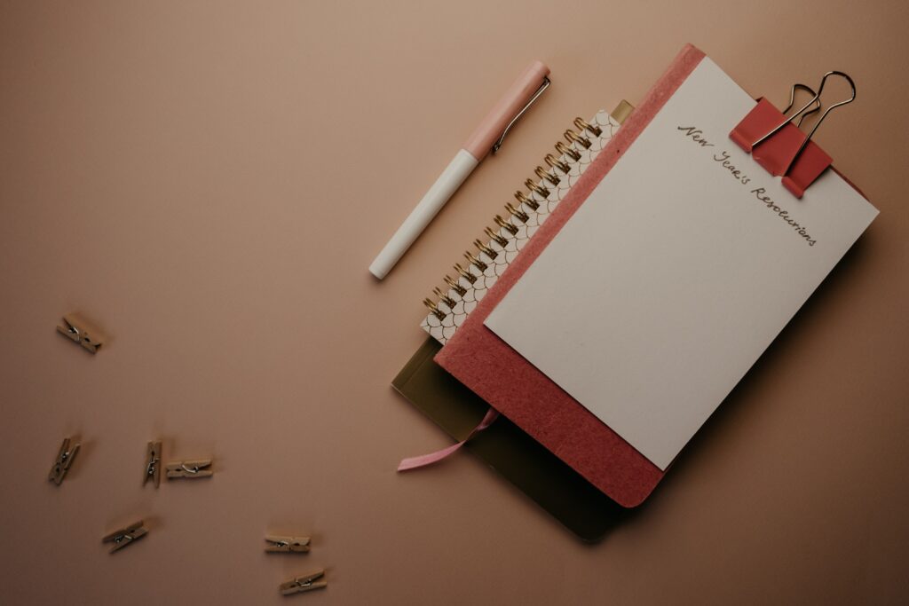 A pen and a diary for new years resolution photography